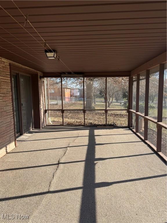 unfurnished sunroom with plenty of natural light