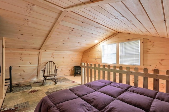 bedroom featuring vaulted ceiling, wood ceiling, and wooden walls