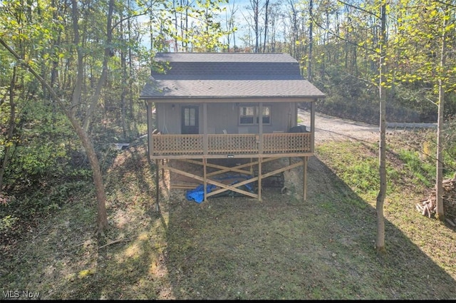 view of outdoor structure featuring a wooded view