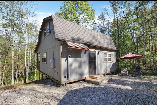 view of outdoor structure featuring entry steps and an outdoor structure