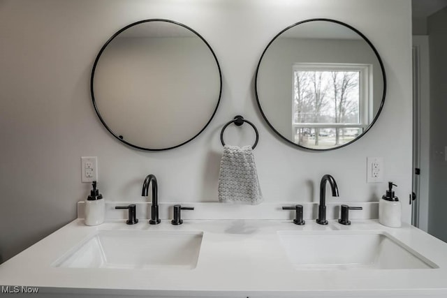 bathroom featuring double vanity and a sink