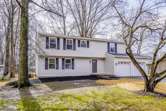 view of front of home with a garage and driveway