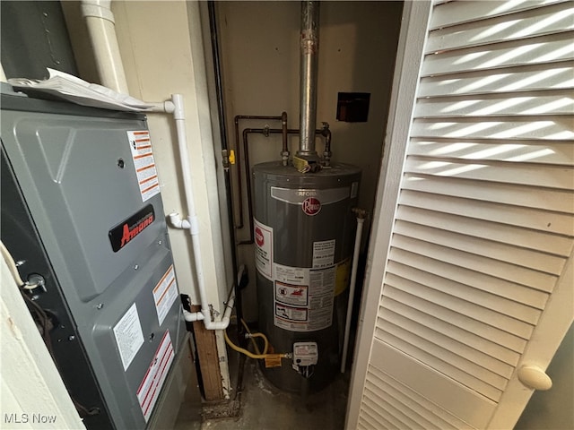 utility room featuring water heater and heating unit