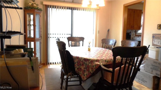 dining area featuring a notable chandelier