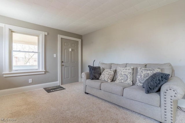 living room with carpet floors and baseboards