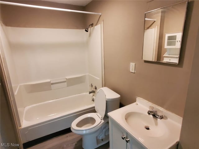 full bath with shower / bath combination, vanity, and toilet