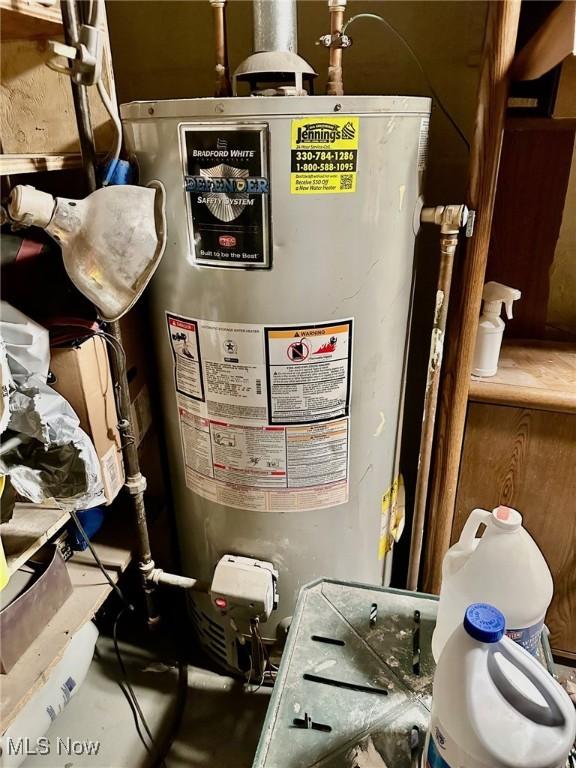 utility room with gas water heater