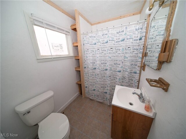bathroom with a shower with curtain, tile patterned flooring, vanity, and toilet