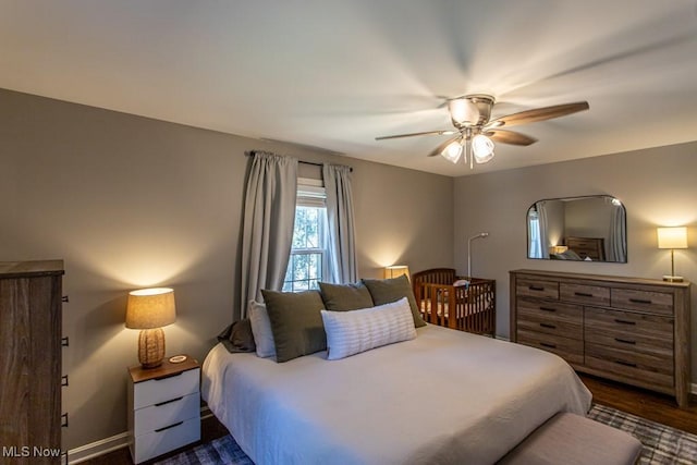 bedroom featuring a ceiling fan and baseboards