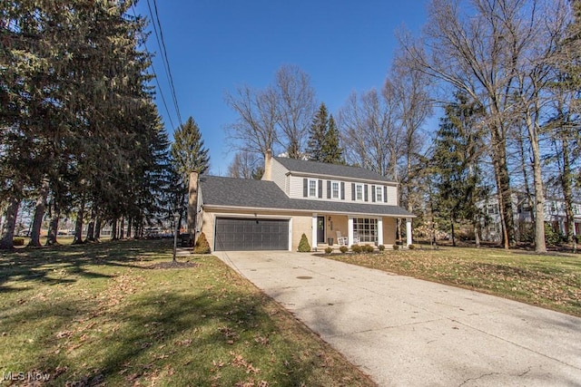 view of front facade with an attached garage, covered porch, concrete driveway, a chimney, and a front yard