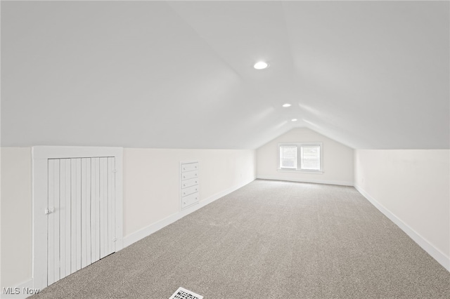 bonus room with lofted ceiling, baseboards, carpet flooring, and recessed lighting