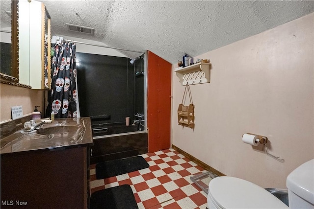 full bathroom featuring visible vents, toilet, tile patterned floors, a textured ceiling, and vanity