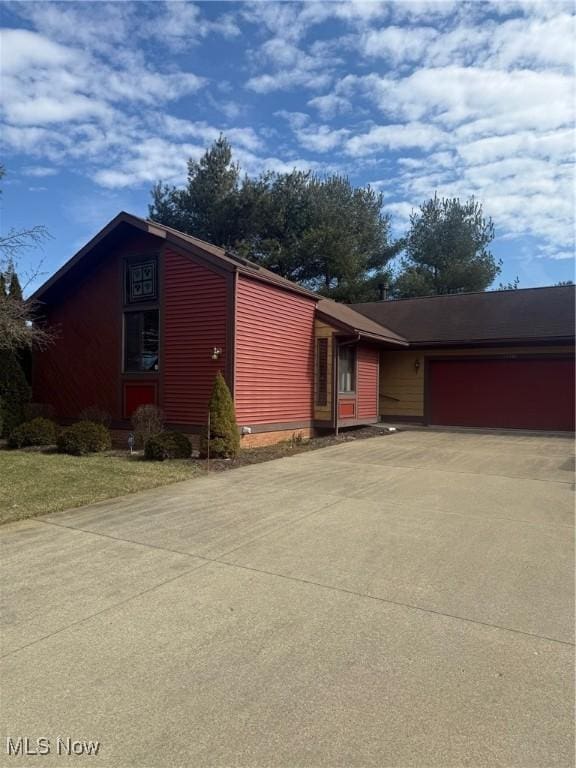 view of front of property with driveway and an attached garage