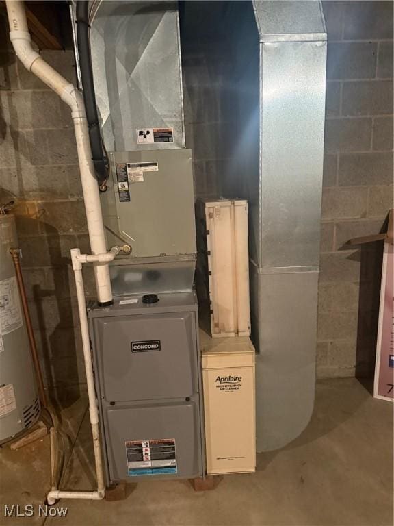 utility room featuring gas water heater