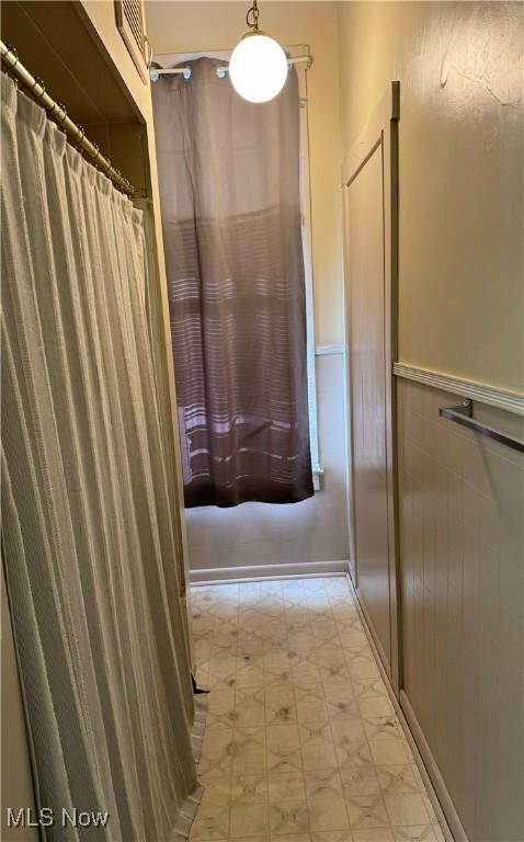 bathroom with tile patterned floors