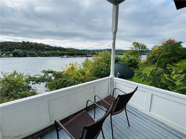 balcony featuring a water view