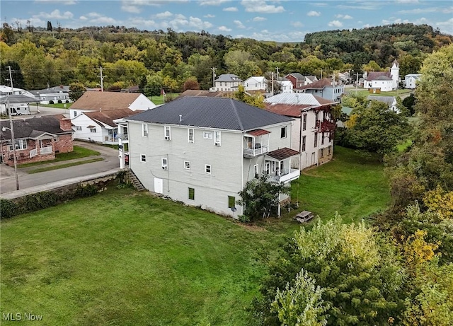 bird's eye view featuring a residential view and a view of trees