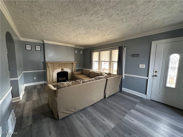 living room featuring ornamental molding, arched walkways, dark wood-style flooring, and plenty of natural light