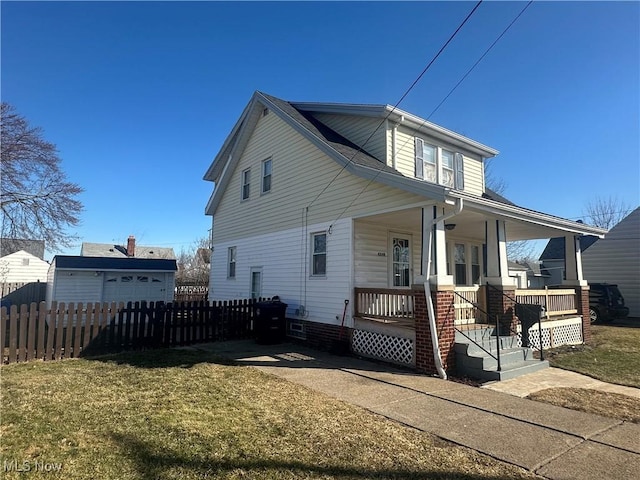 view of front of property featuring a porch, a front yard, and fence