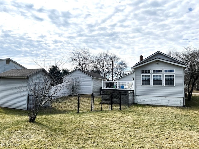 view of yard with fence and an outdoor structure