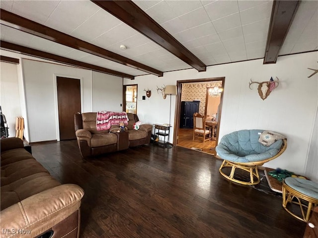 living area with beamed ceiling and wood finished floors
