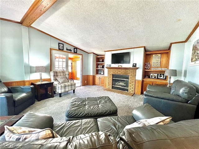 living room with lofted ceiling with beams, carpet floors, wainscoting, and crown molding
