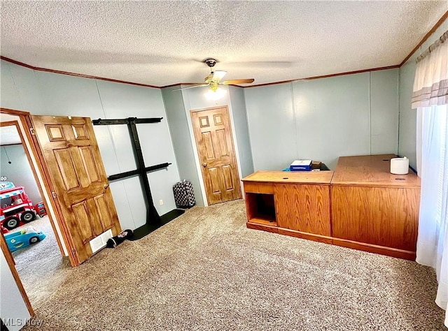 office with ceiling fan, carpet floors, and ornamental molding
