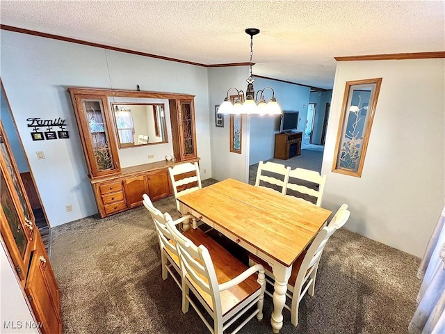 dining space with a textured ceiling, dark carpet, and crown molding