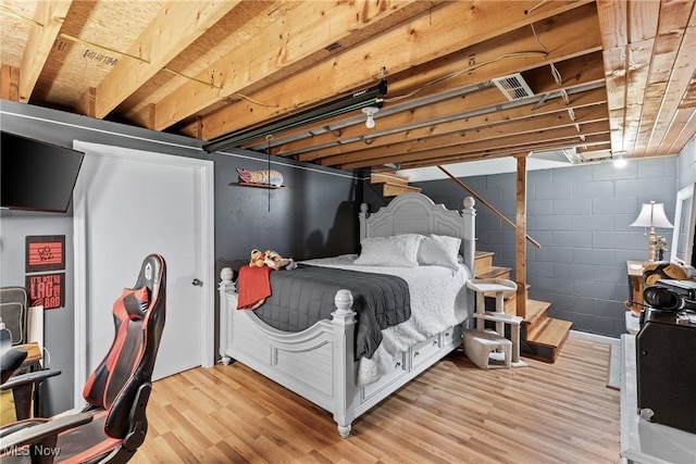 bedroom featuring light wood-style floors