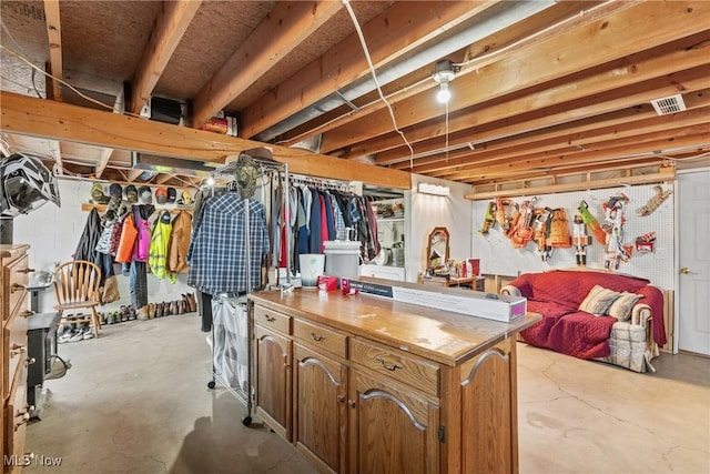 unfinished basement featuring visible vents