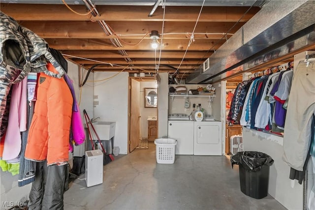 unfinished below grade area with washer and dryer and visible vents