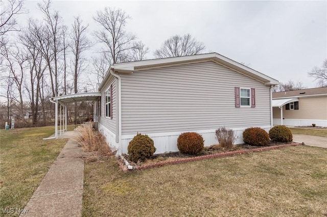 view of property exterior featuring driveway, an attached carport, and a lawn