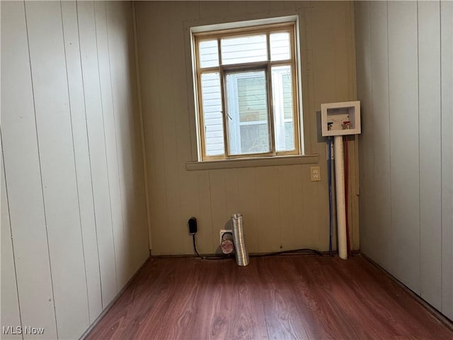 spare room featuring wood finished floors