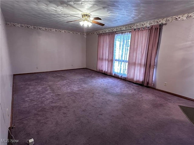 empty room with a ceiling fan, carpet, a textured ceiling, and baseboards