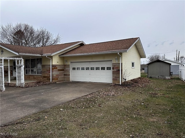 view of front of property featuring a garage, stone siding, concrete driveway, and roof with shingles