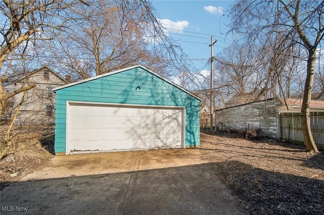 detached garage with fence