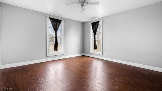 unfurnished room featuring ceiling fan, hardwood / wood-style flooring, and baseboards