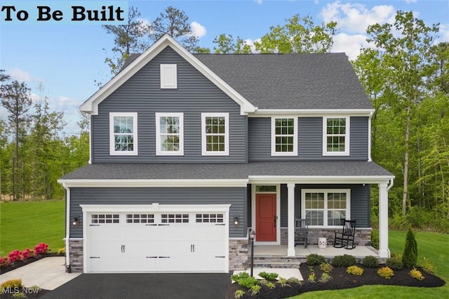 view of front of house featuring a garage, stone siding, covered porch, and a front lawn