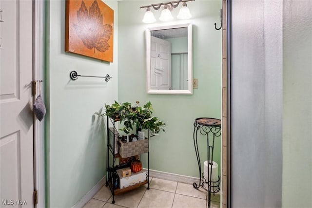 bathroom featuring tile patterned flooring and baseboards