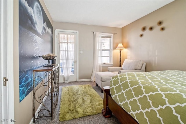 bedroom featuring baseboards and carpet flooring