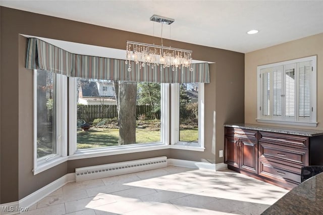 dining space featuring recessed lighting, an inviting chandelier, light tile patterned flooring, and baseboards