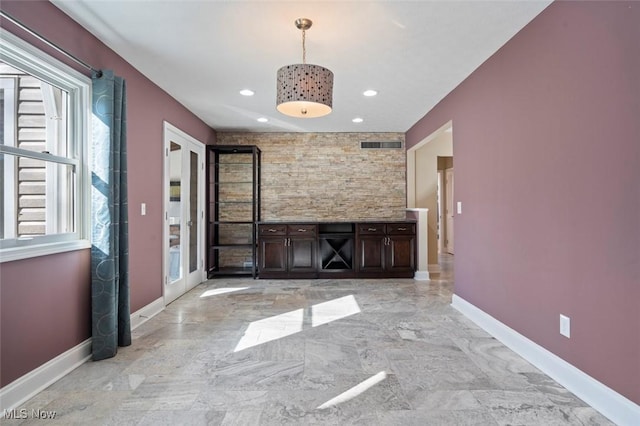 interior space featuring recessed lighting, marble finish floor, visible vents, and baseboards