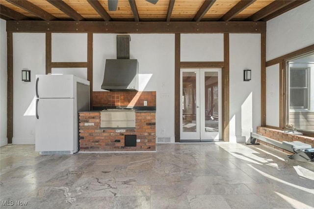 view of patio / terrace featuring visible vents, exterior kitchen, and french doors