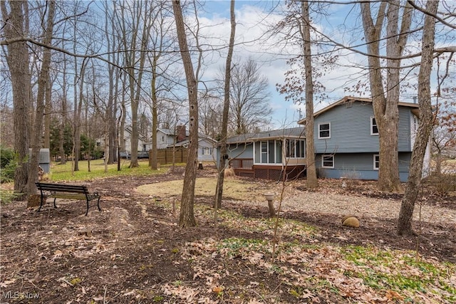 view of yard featuring a sunroom