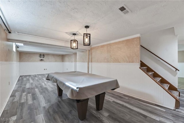 game room with visible vents, wainscoting, a textured ceiling, wood finished floors, and billiards