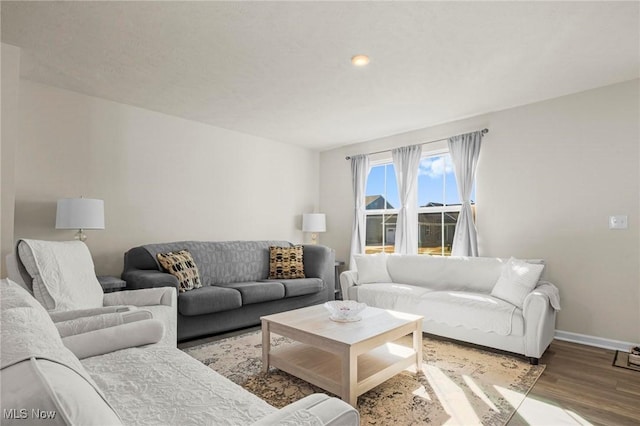 living room featuring light wood-style flooring and baseboards