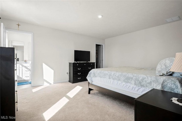 bedroom featuring light colored carpet