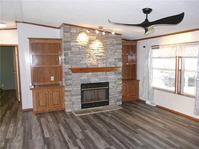 unfurnished living room with a fireplace, wood finished floors, and crown molding