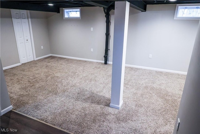 basement with carpet and baseboards