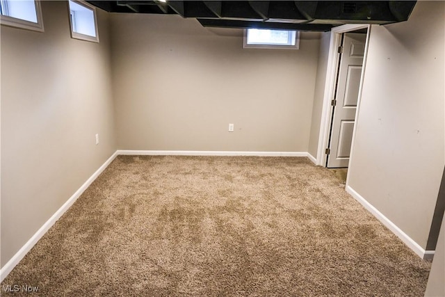 basement with carpet floors and baseboards